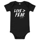 Love > Fear Baby Onesie
